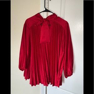 Red silk fabric neck blouse.